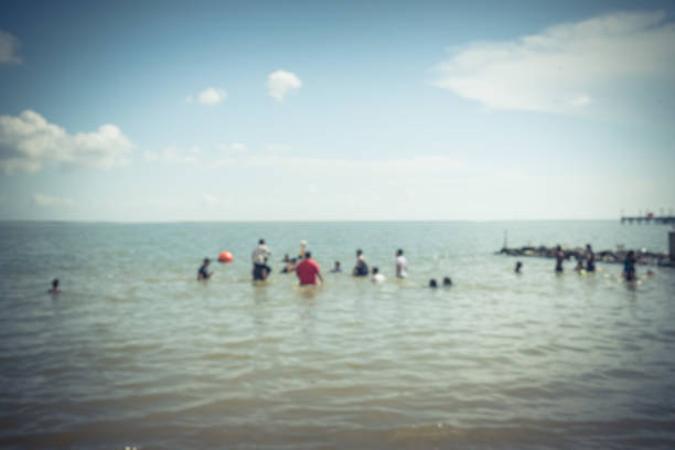 istock Blurred people on beach La Porte, Texas, USA 863592274