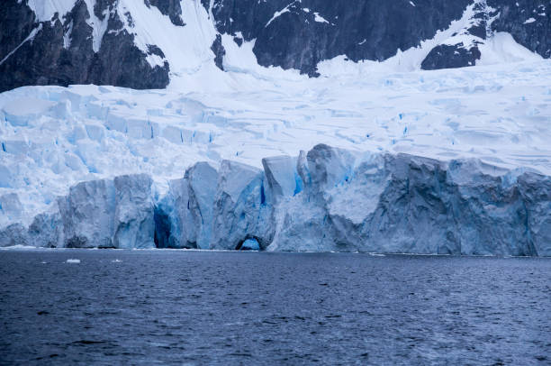 istock Blue ice shines through the cracks in this glacier in the Errera channel 863592886