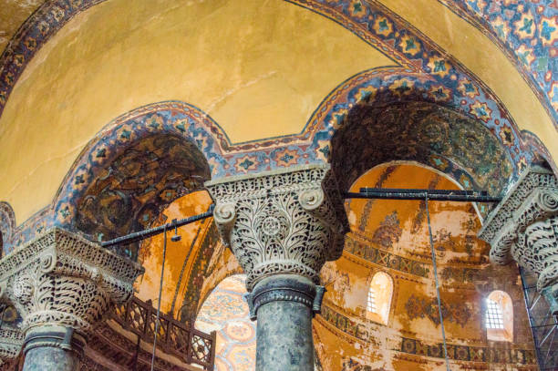 Decorated architectural columns in the Haga Sophia, Istanbul, Turkey. In the background the dome of the basilica is visible