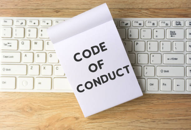 code of conduct word on note pad - questão social imagens e fotografias de stock