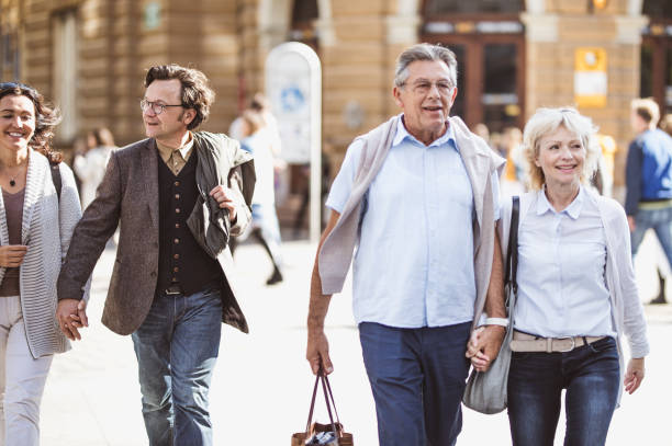 istock Mature Couples Walking Around Old Town 863604450