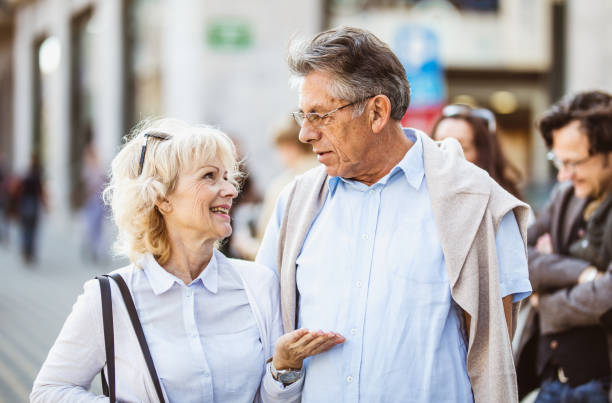 istock Senior Couple Walking Around Old Town 863604538