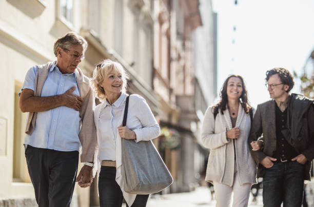 istock Mature Couples Walking Around Old Town 863604626