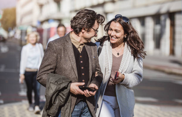 istock Mature Couples Walking Around Old Town 863604754