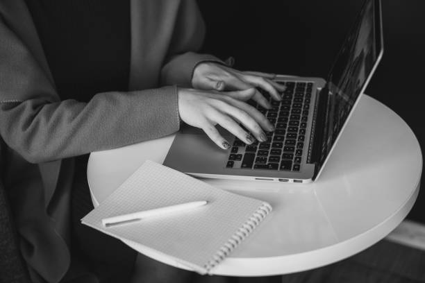 istock Young woman sitting in a cafe with laptop 863604848