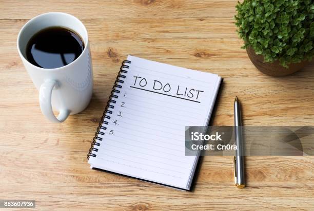 To Do List On Note Pad With Coffee And Pen On Office Desk Stock Photo - Download Image Now