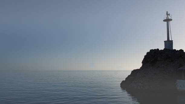 istock The merged horizon on a lighthouse 863613584