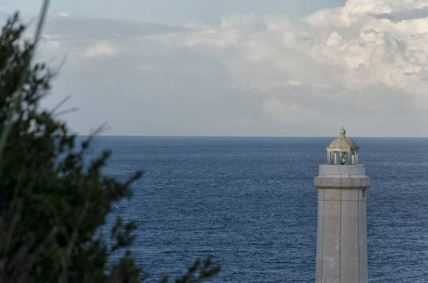 View of the lighthouse of Punta Palascia at sunset