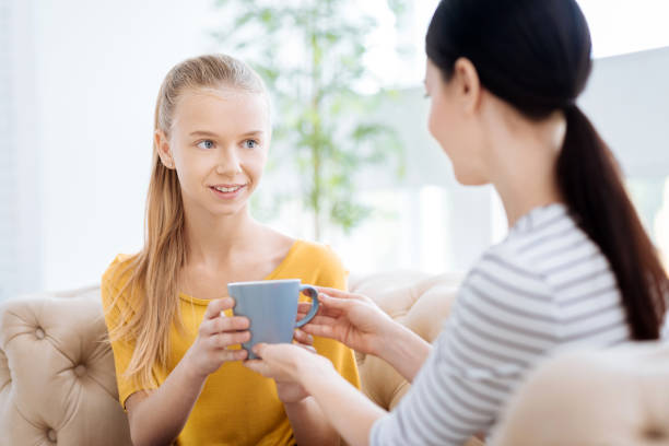 istock Delighted cheerful woman taking a cup of tea 863620596