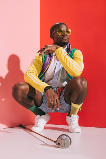 istock stylish man with golf club 863621254