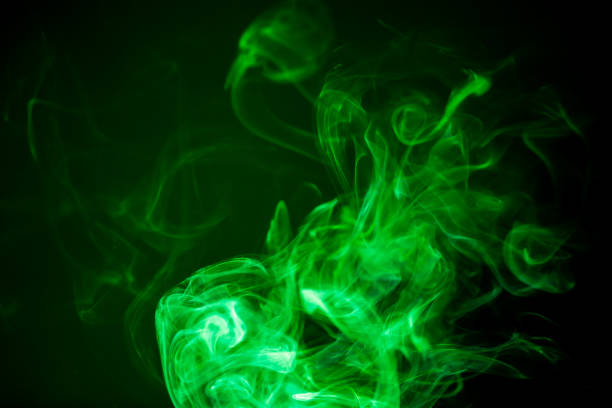 istock Green smoke motion on black background. 863621860