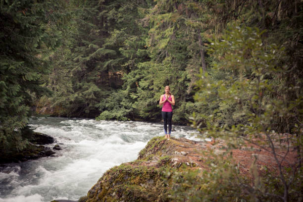 istock Tranquil Yoga session by the river 863624682