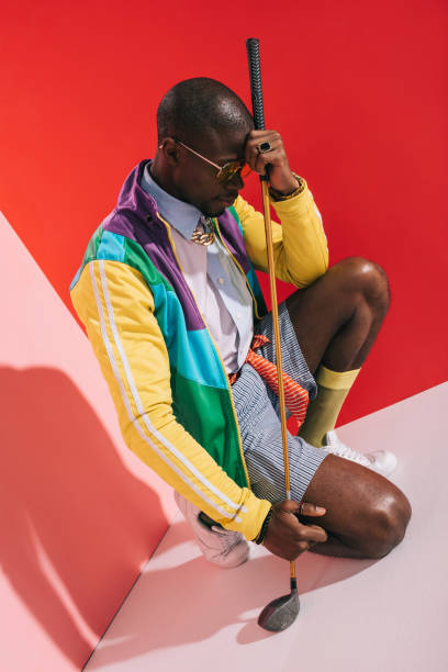 istock stylish man with golf club 863629688