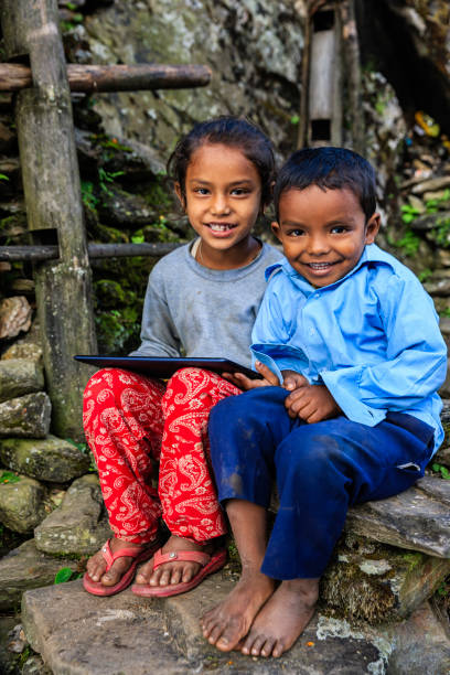 istock Nepali children using digital tablet near Annapurna Range 863656384