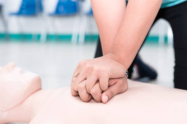 istock Nursing students are learning how to rescue the patients in emergency. CPR training with CPR doll. 863656712