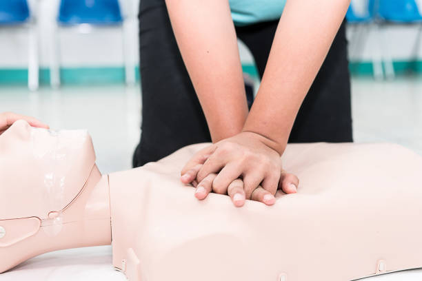 Nursing students are learning how to rescue the patients in emergency. CPR training with CPR doll.