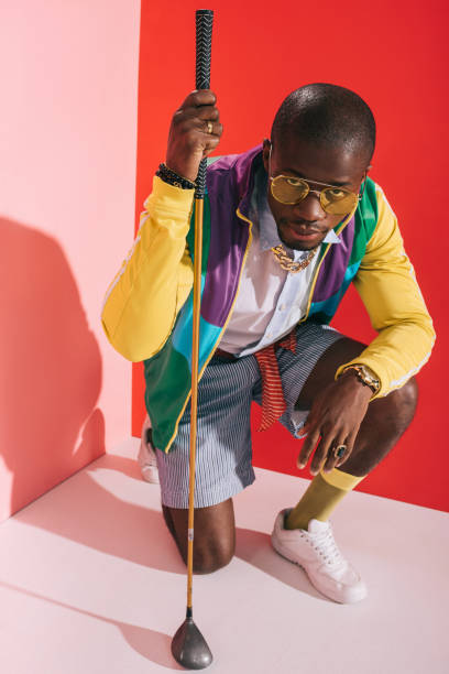 istock stylish man with golf club 863658232