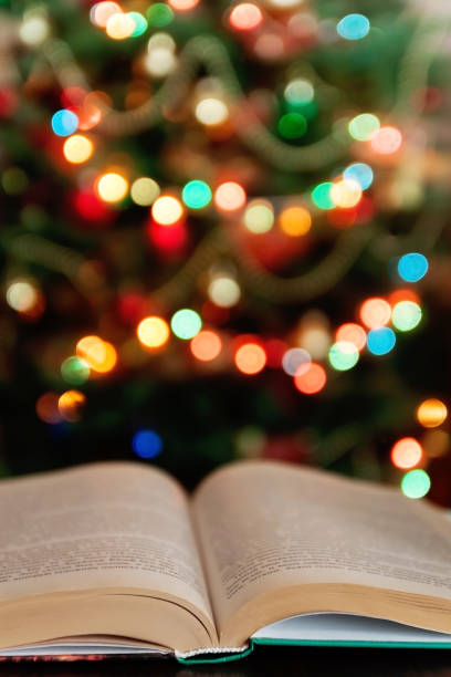 istock Christmas and bible with blurred candles light background 863661500