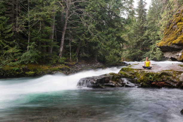 istock Yoga near the river - tranquility 863670762