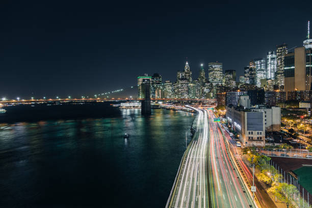 istock Manhattan Skyline and Traffic at Night 863671386
