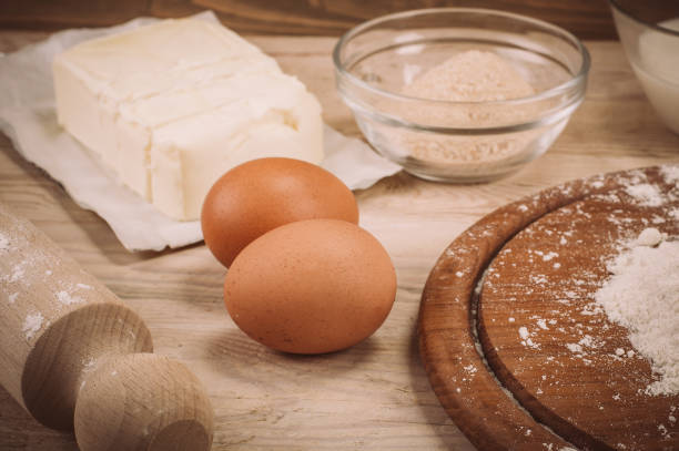istock Food ingredients for dough a wooden kitchen board 863681208