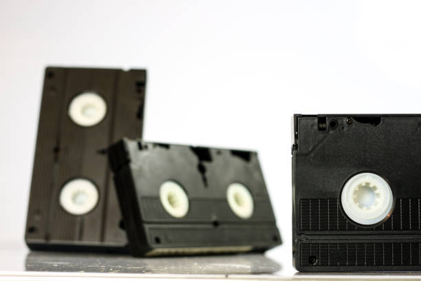 istock Old good video cassettes. Dusty family recordings on solid data carriers, white isolated background. 863681260