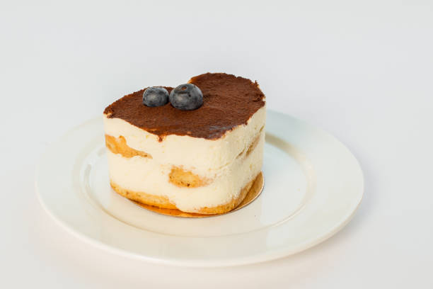 istock tiramisu heart dessert on a plate on a white background 863681534