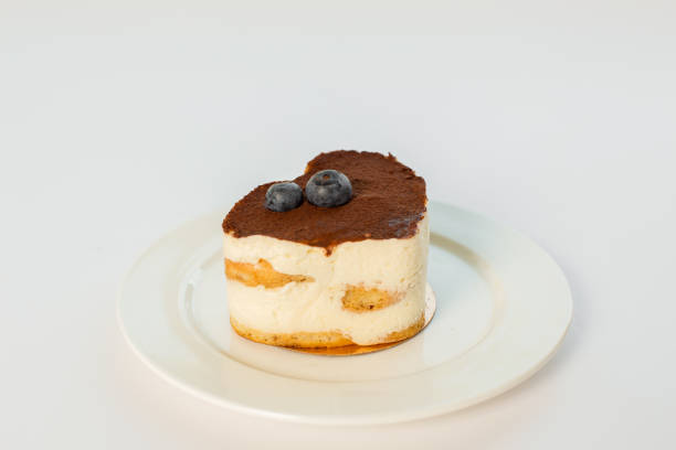 istock tiramisu heart dessert on a plate on a white background 863681546