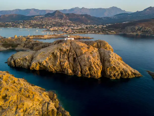 Photo of Aerial view of the Pietra Lighthouse at sunset and the Genoese tower, L'Ile-Rousse, Corsica Red Island, Corsica, France