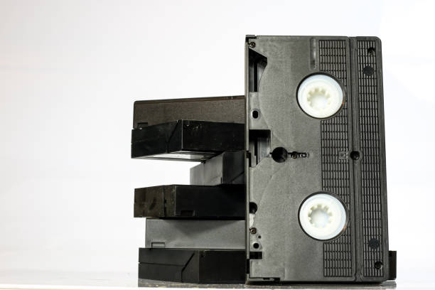 istock Old good video cassettes. Dusty family recordings on solid data carriers, white isolated background. 863681710