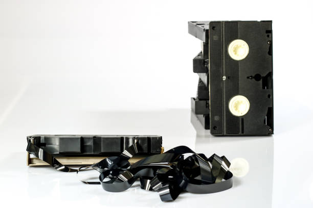 istock Old good video cassettes. Dusty family recordings on solid data carriers, white isolated background. 863682410