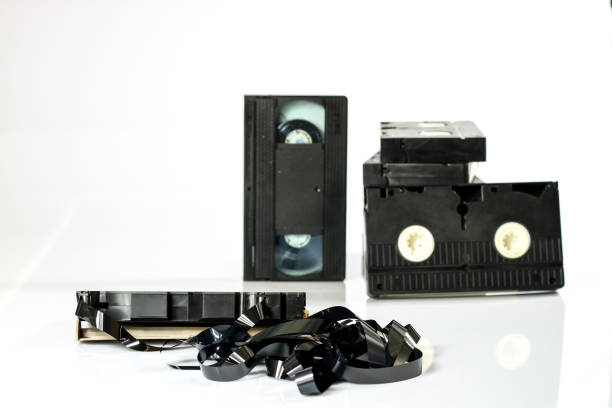 istock Old good video cassettes. Dusty family recordings on solid data carriers, white isolated background. 863682694
