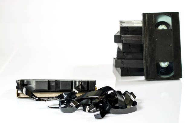 istock Old good video cassettes. Dusty family recordings on solid data carriers, white isolated background. 863685072