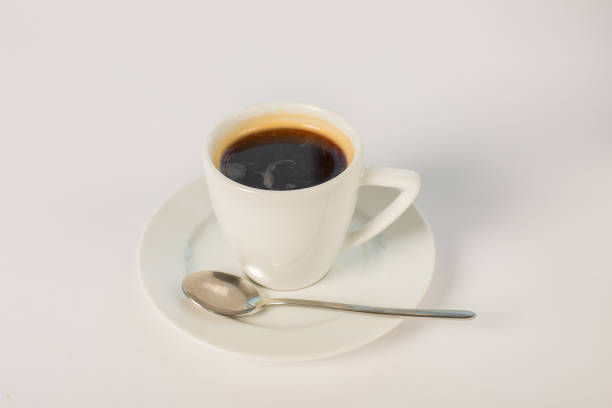 istock a cup of coffee on a saucer on a white background 863685652
