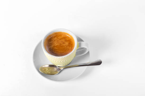 istock a cup of coffee on a saucer on a white background 863685716