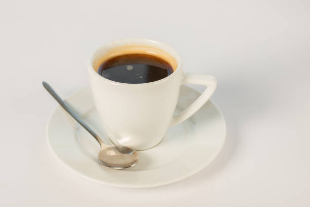 istock a cup of coffee on a saucer on a white background 863685726
