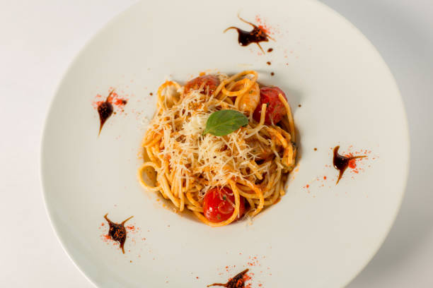 istock spaghetti with tomato and cheese on a white background 863685868
