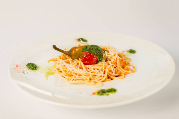 istock spaghetti with tomato and pepper on a white background 863685896