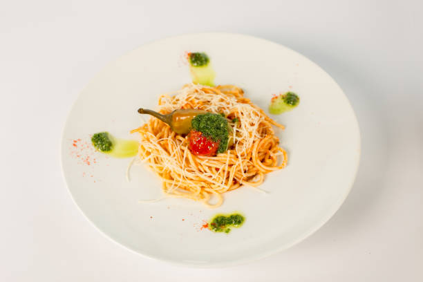 istock spaghetti with tomato and pepper on a white background 863685926