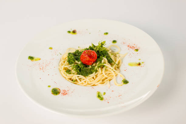 istock spaghetti with cheese and greens on a white background 863685932