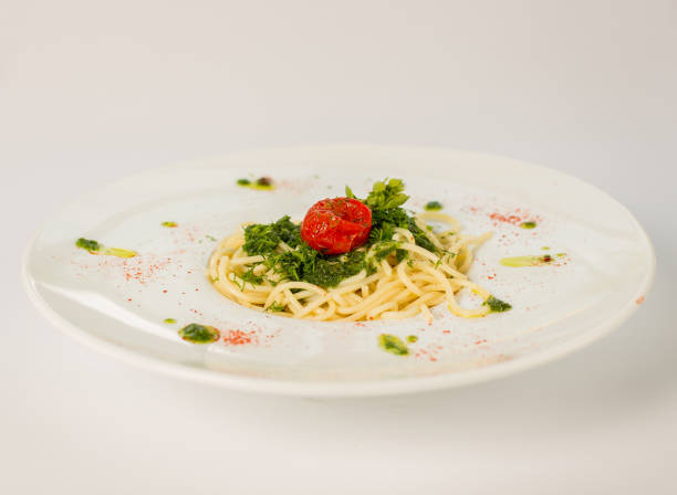 istock spaghetti with cheese and greens on a white background 863685934