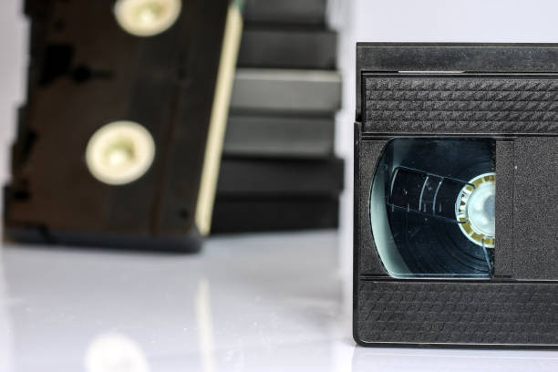 istock Old good video cassettes. Dusty family recordings on solid data carriers, white isolated background. 863686280