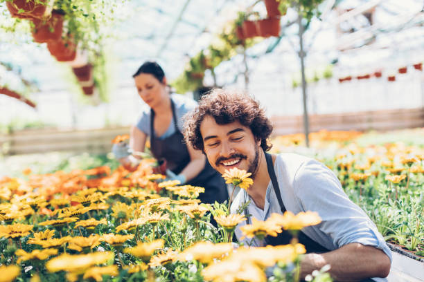 Happy gardener admiring the flowers