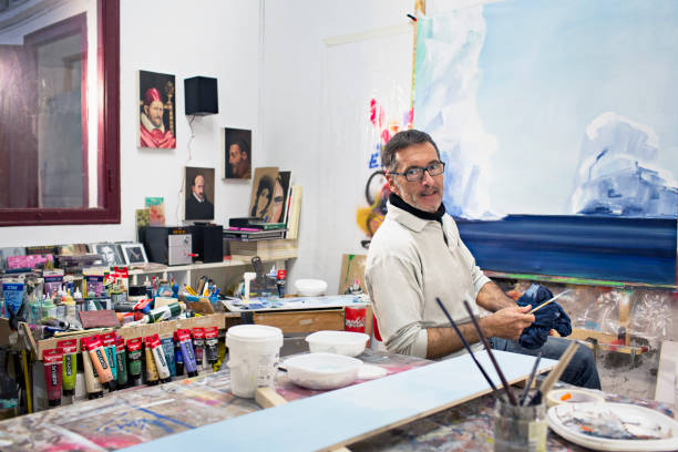 Mature artist businessman on his art studio