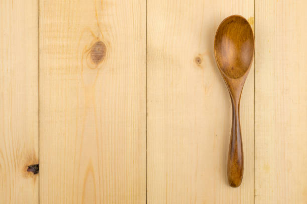istock Wooden spoon for dessert bakery on the pine table. 863702570