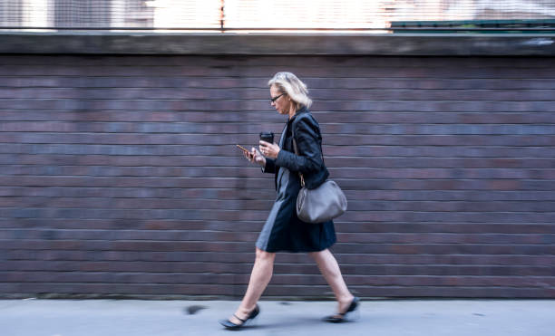 istock Business woman using smart phone in London 863717468