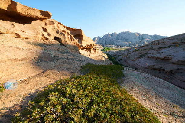 istock Large stones on a background of green grass 863722976
