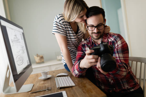 istock Young attractive designers working together from home 863728800