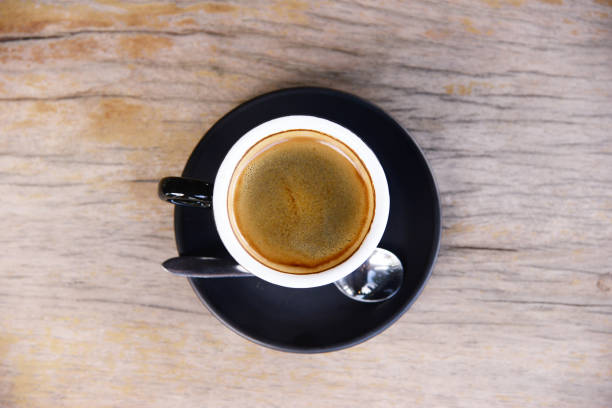 istock black coffee in black coffee cup for breakfast or coffee break time on wooden table 863743180