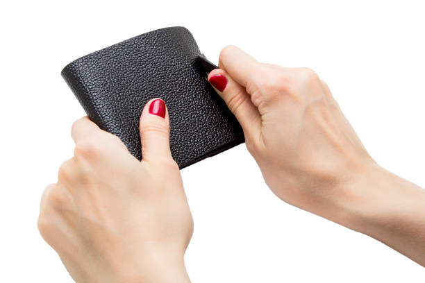 istock Black leather purse in hands on white background 863750028